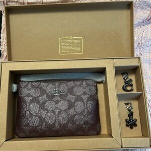 Coach Signature Metallic Corner Zip Wristlet with Charms Wine still in box